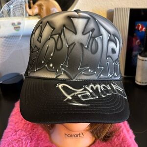 “You Tube Famous” hand, painted tagged Trucker hat with adjustable snapback and